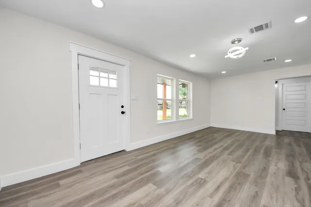 a view of kitchen and kitchen with wooden floor