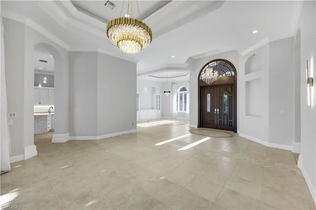 a view of an empty room and a windows