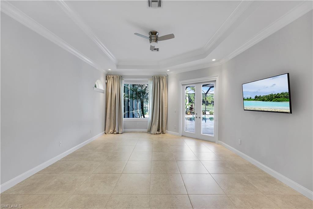 10072 Orchid Ridge Lane Estero, FL 34135 - Photo 26 of 48 a view of a livingroom with wooden floor and a ceiling fan