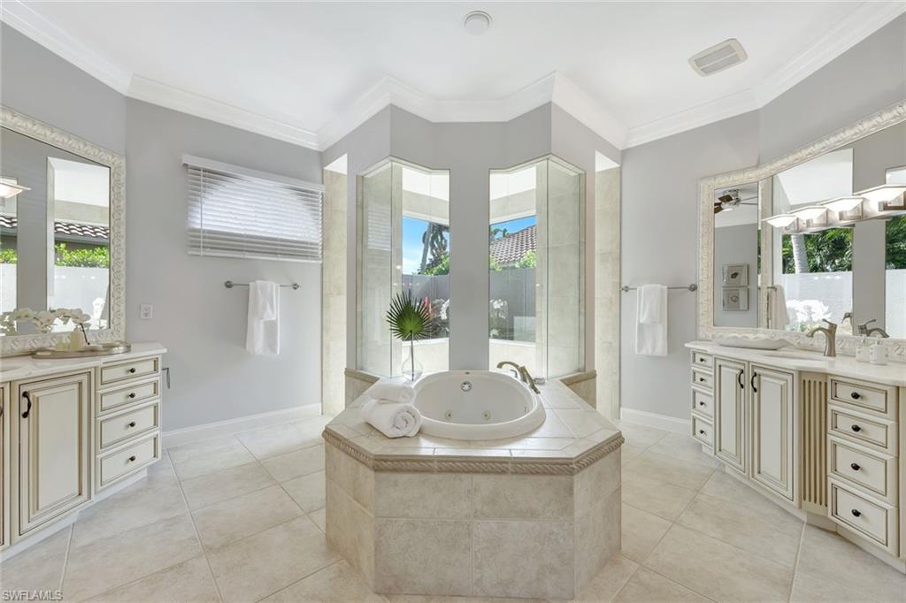 10072 Orchid Ridge Lane Estero, FL 34135 - Photo 27 of 48 a bathroom with a granite countertop sink and a mirror
