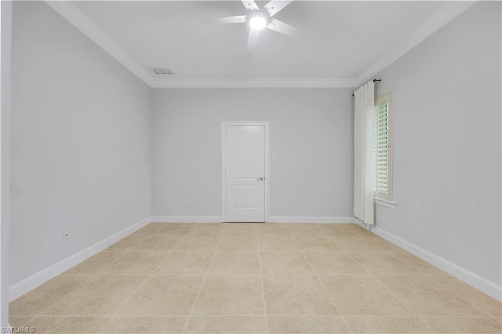 10072 Orchid Ridge Lane Estero, FL 34135 - Photo 31 of 48 a view of an empty room with a window