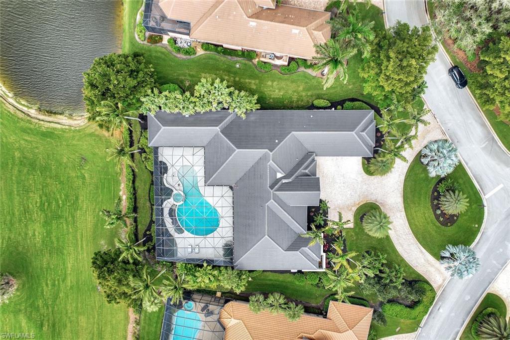 10072 Orchid Ridge Lane Estero, FL 34135 - Photo 42 of 48 an aerial view of a house with garden space and a lake view