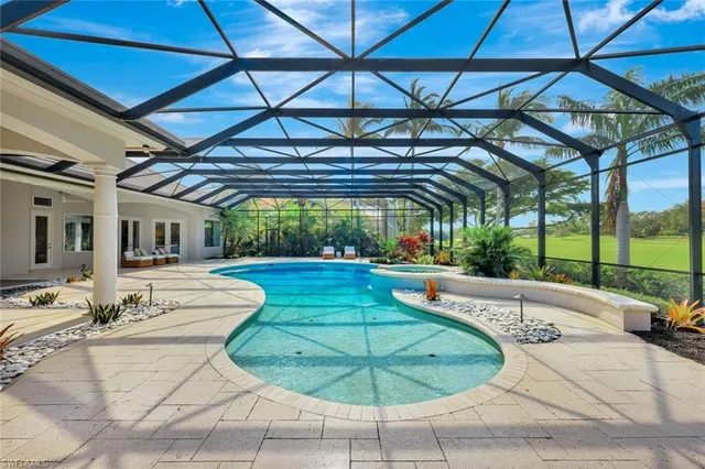 a view of a swimming pool with a patio