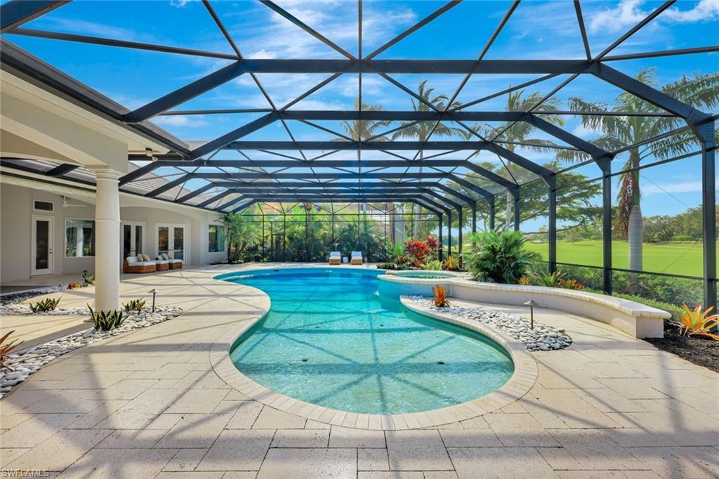 10072 Orchid Ridge Lane Estero, FL 34135 - Photo 45 of 48 a view of a swimming pool with a patio