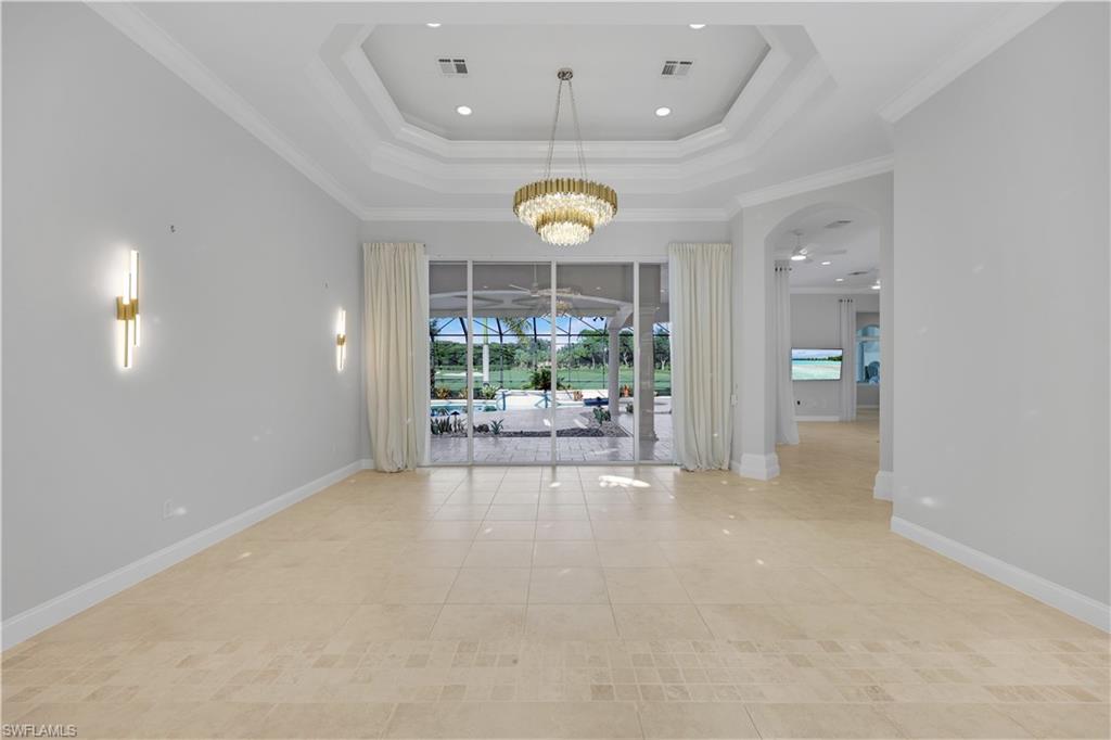 10072 Orchid Ridge Lane Estero, FL 34135 - Photo 6 of 48 a view of a livingroom with wooden floor and a large window