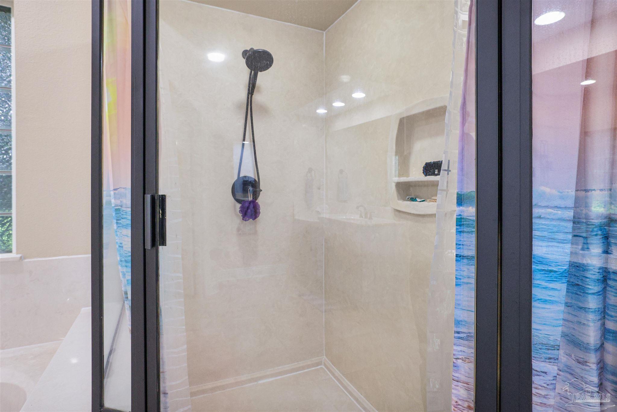 2822 Frederick Street Cantonment, FL 32533 - Photo 17 of 42 a bathroom with a shower