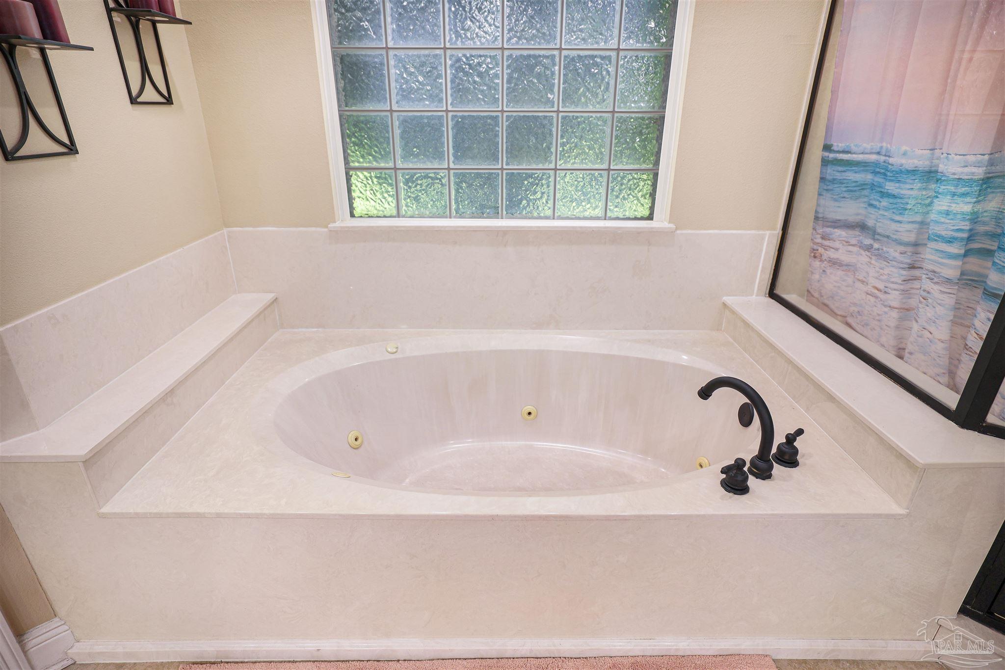 2822 Frederick Street Cantonment, FL 32533 - Photo 18 of 42 a bathroom with bathtub