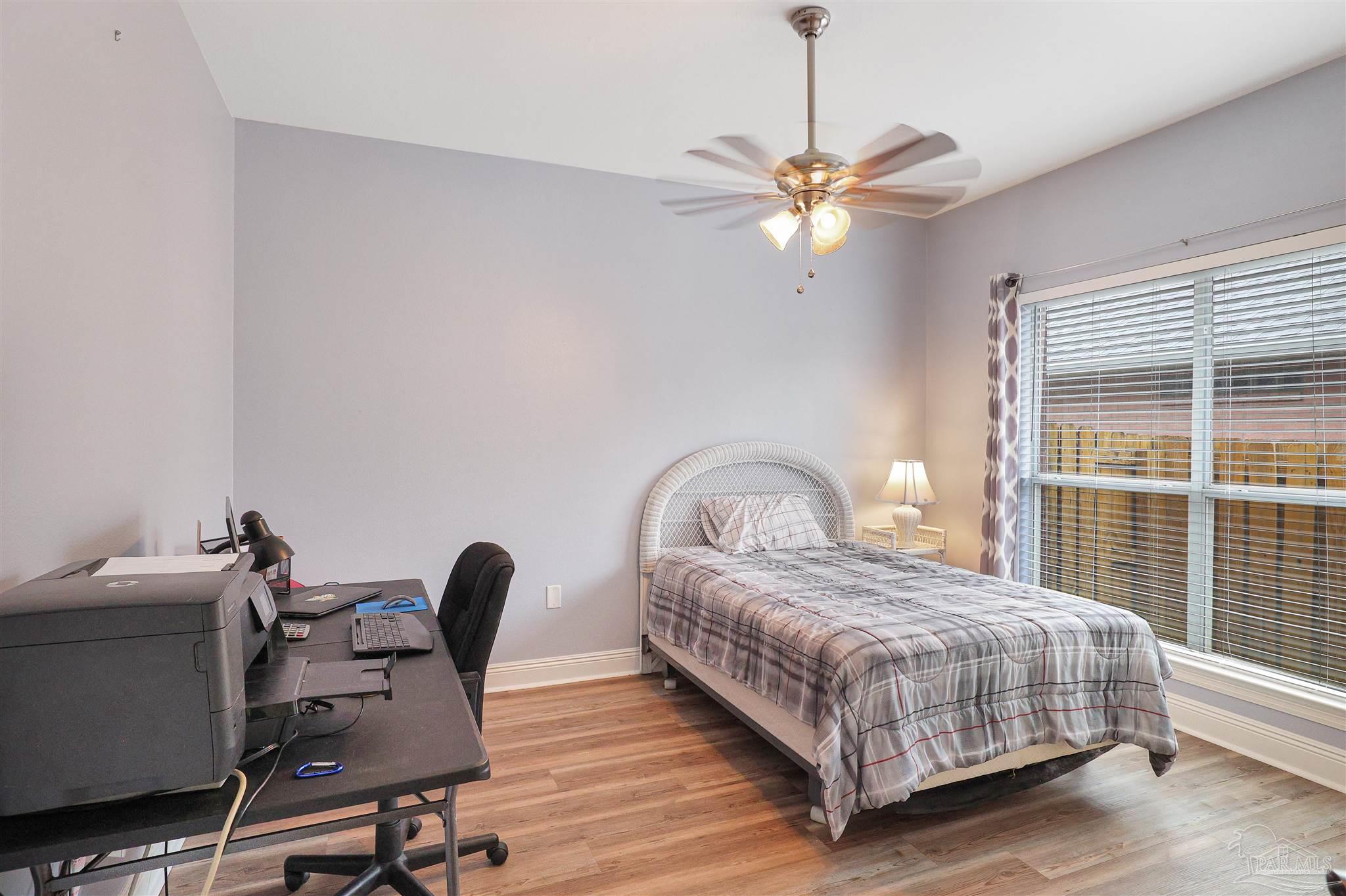 2822 Frederick Street Cantonment, FL 32533 - Photo 20 of 42 a bedroom with a bed and a window