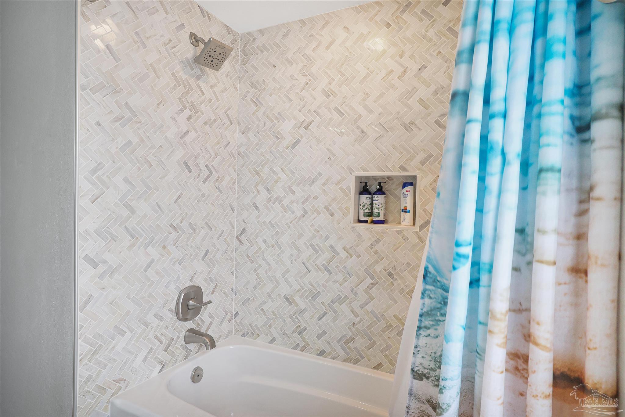 2822 Frederick Street Cantonment, FL 32533 - Photo 23 of 42 a bathroom with a bathtub