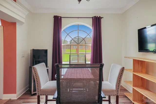 a view of a livingroom with furniture window and wooden floor