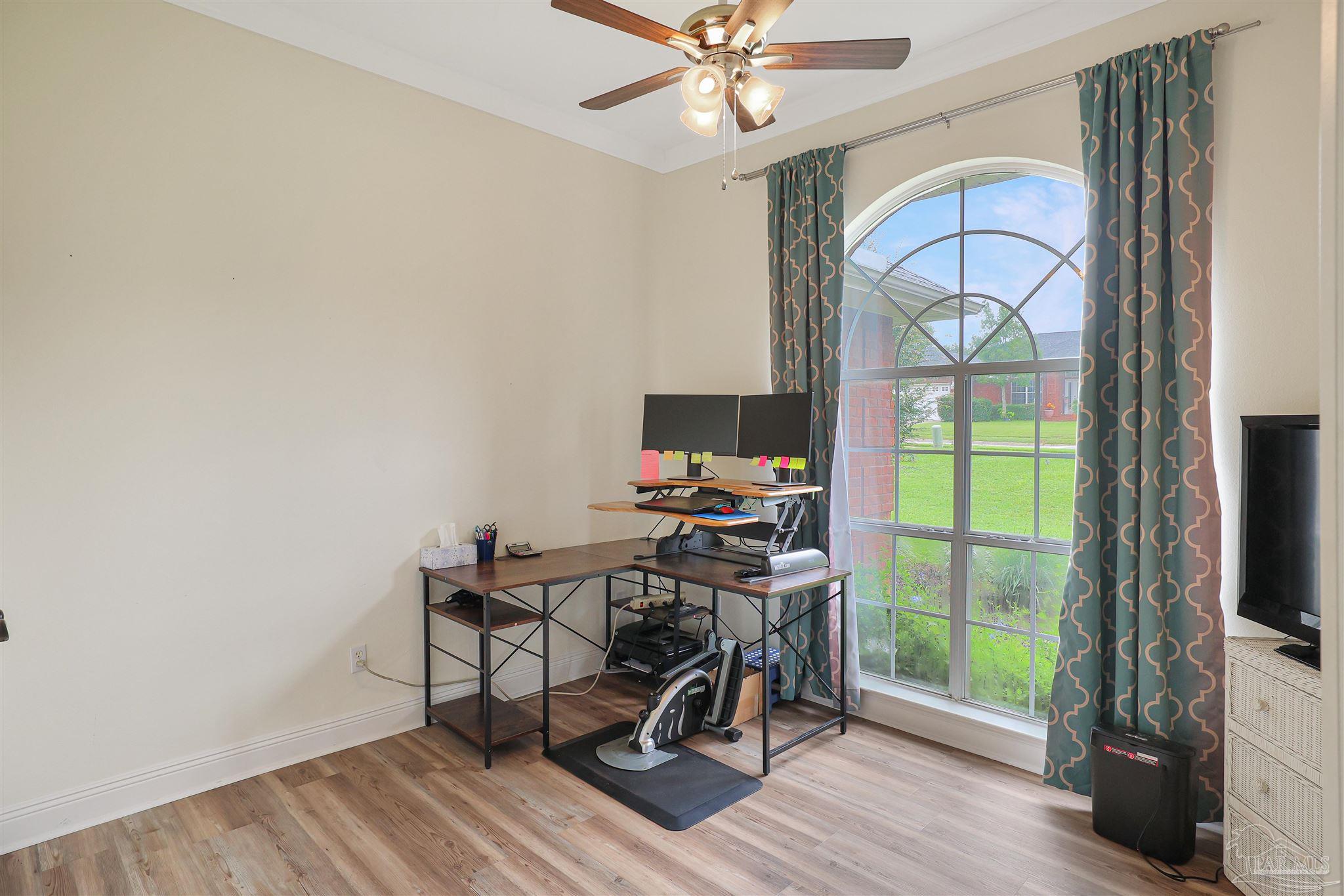 2822 Frederick Street Cantonment, FL 32533 - Photo 28 of 42 a view of a workspace with furniture and a window