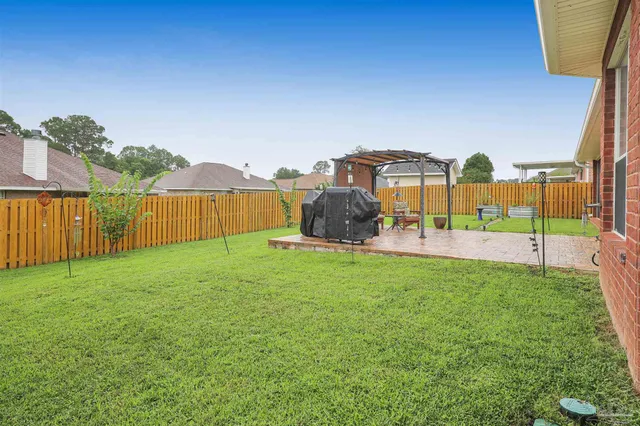 a view of a garden with a small house