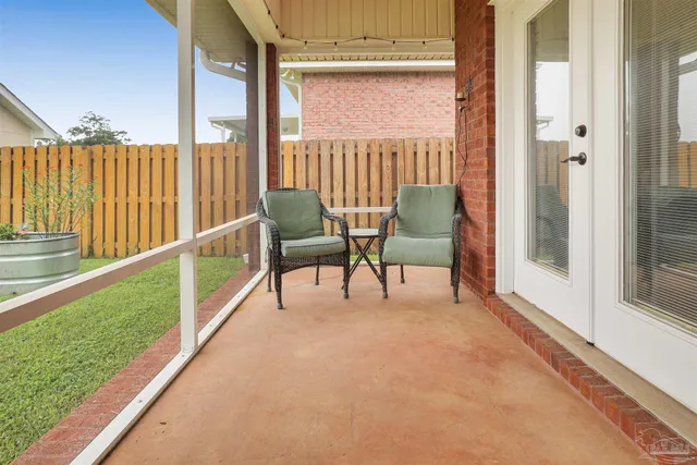 a view of a two chairs in the balcony
