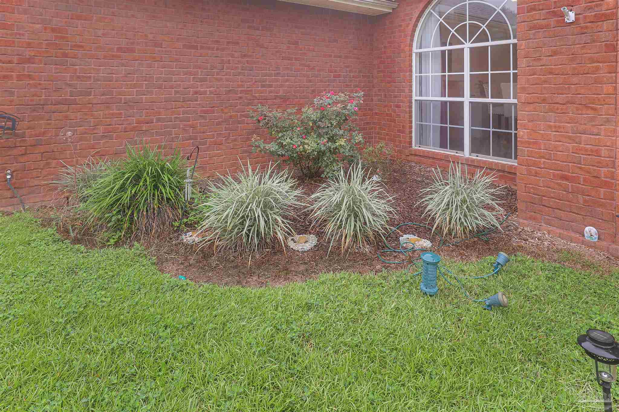 2822 Frederick Street Cantonment, FL 32533 - Photo 41 of 42 a front view of a house with a yard