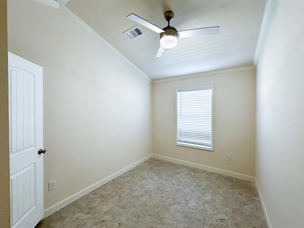 153 Cabrera Street Oak Point, TX 75068 - Photo 10 of 22 Room featuring light-toned walls, crown molding, and a ceiling fan with integrated lighting