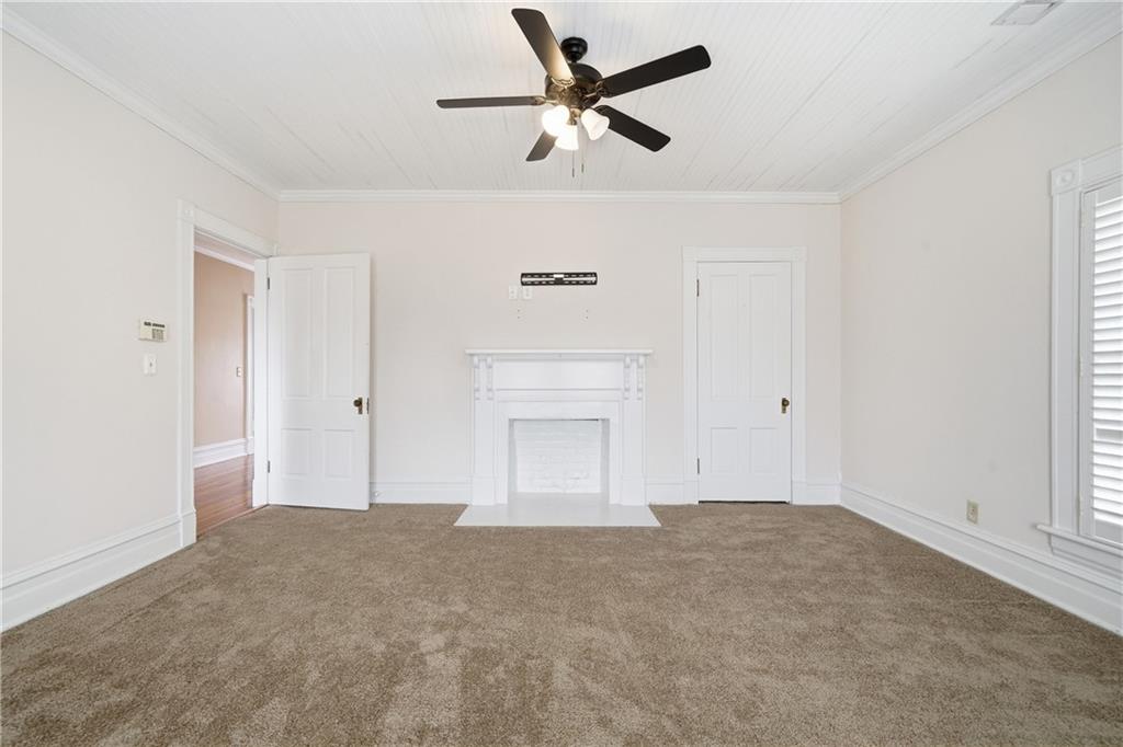 880 Johnstonville Road Barnesville, GA 30204 - Photo 22 of 33 a view of an empty room with a ceiling fan