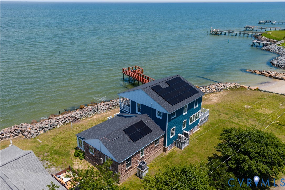 154 Riverside Drive Deltaville, VA 23043 - Photo 8 of 38 a aerial view of a house with a ocean view