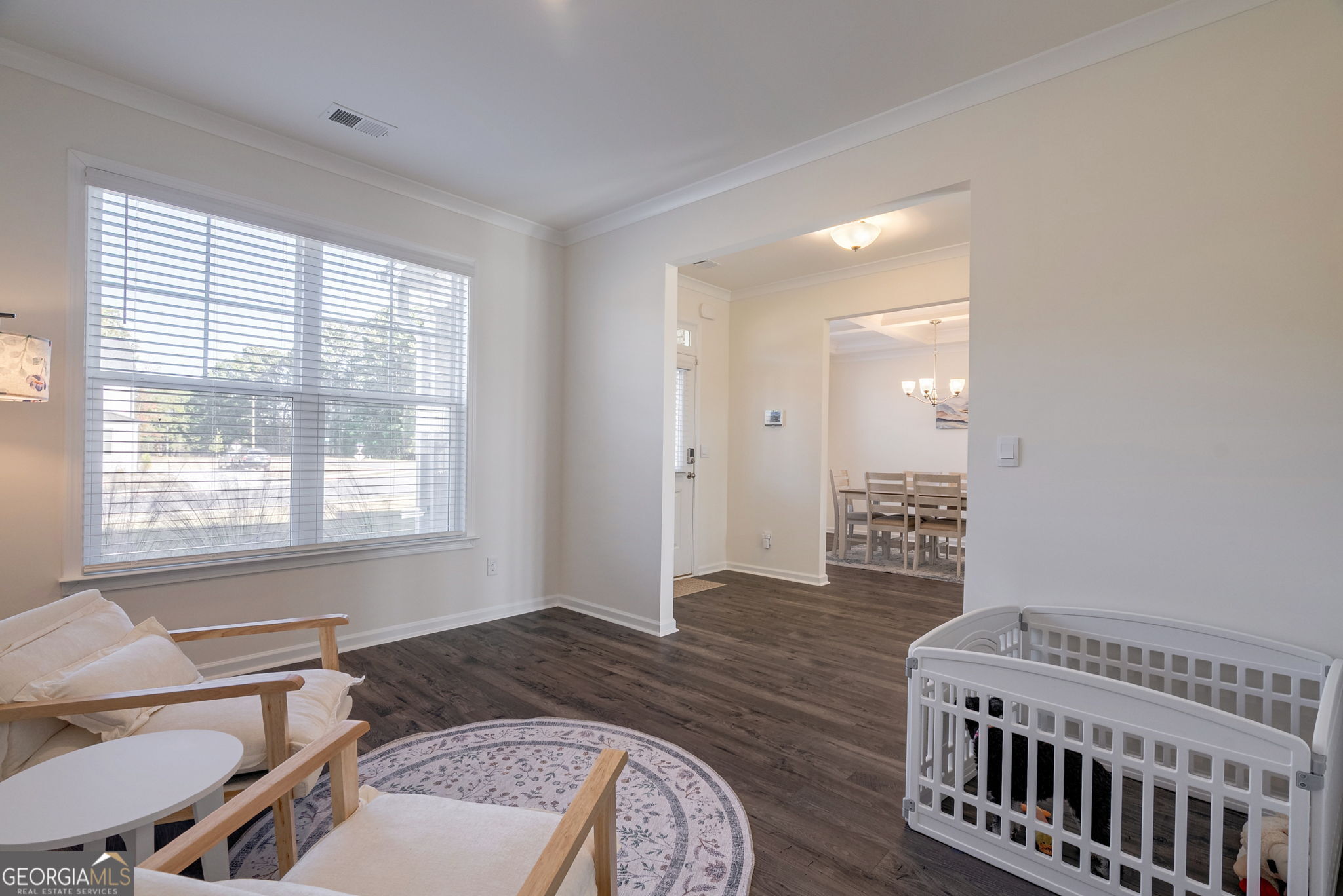 1110 Brookstone Crossing Statham, GA 30666 - Photo 15 of 69 a spacious bedroom with a bed and wooden floor