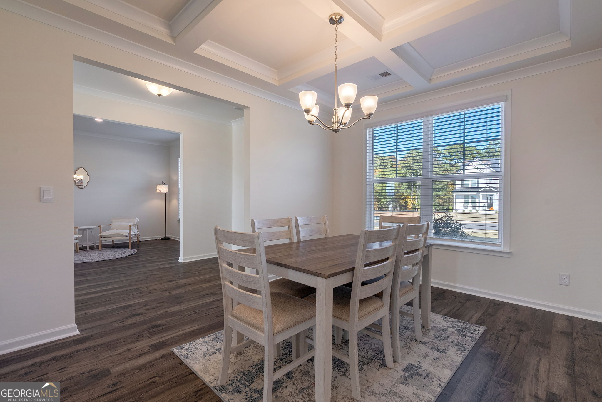 1110 Brookstone Crossing Statham, GA 30666 - Photo 17 of 69 a view of a dining room with furniture wooden floor and chandelier