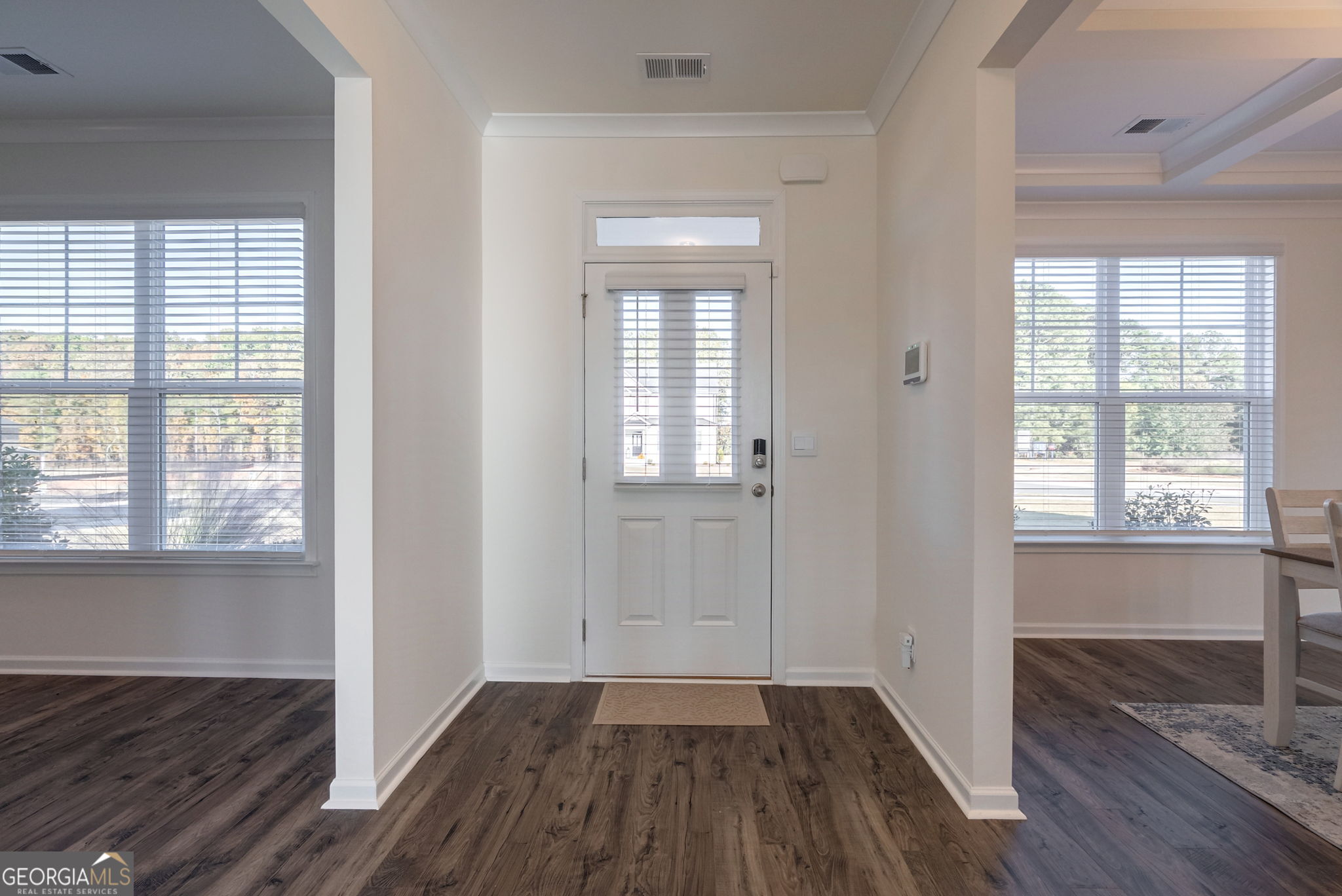 1110 Brookstone Crossing Statham, GA 30666 - Photo 18 of 69 an empty room with wooden floor and windows