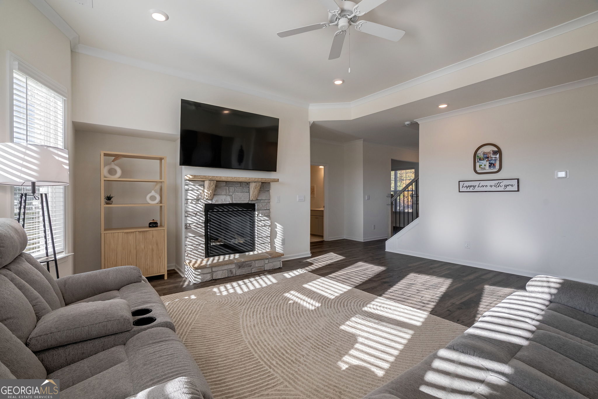 1110 Brookstone Crossing Statham, GA 30666 - Photo 22 of 69 a living room with furniture and a flat screen tv