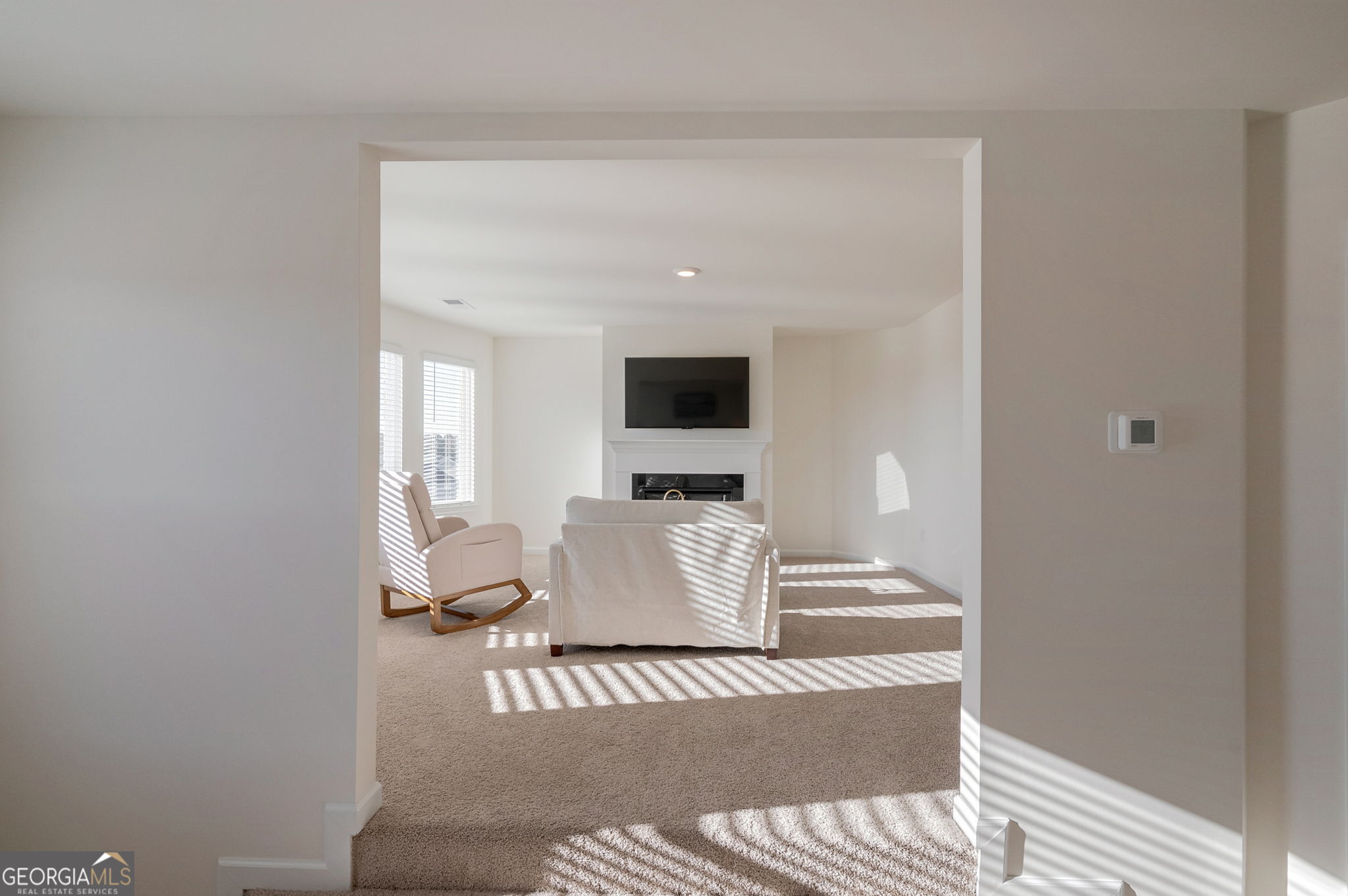 1110 Brookstone Crossing Statham, GA 30666 - Photo 37 of 69 a living room with a couch and a window