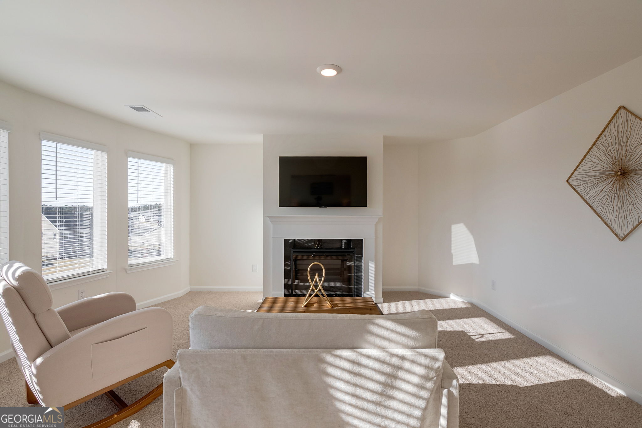 1110 Brookstone Crossing Statham, GA 30666 - Photo 38 of 69 a living room with furniture a fireplace and a flat screen tv