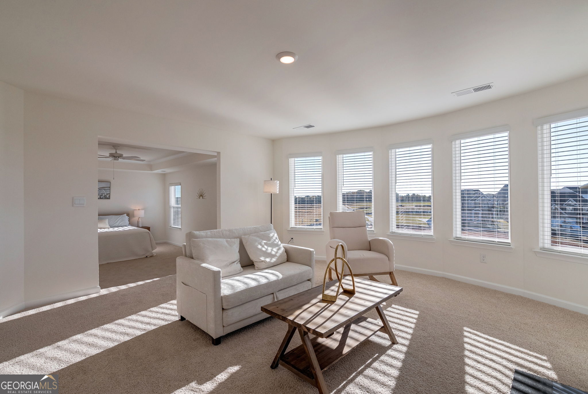 1110 Brookstone Crossing Statham, GA 30666 - Photo 39 of 69 a living room with furniture and a large window