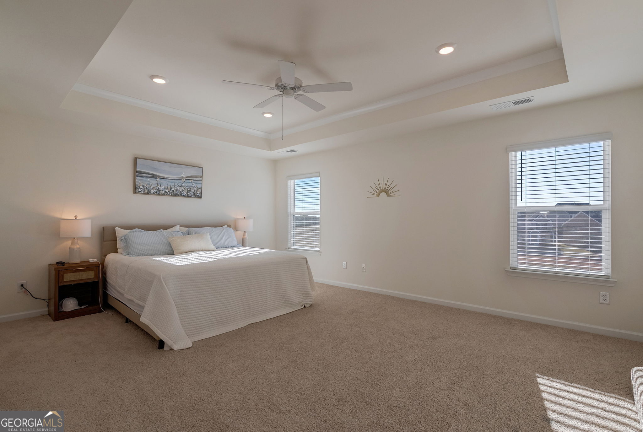 1110 Brookstone Crossing Statham, GA 30666 - Photo 4 of 69 a spacious bedroom with a bed and a chandelier