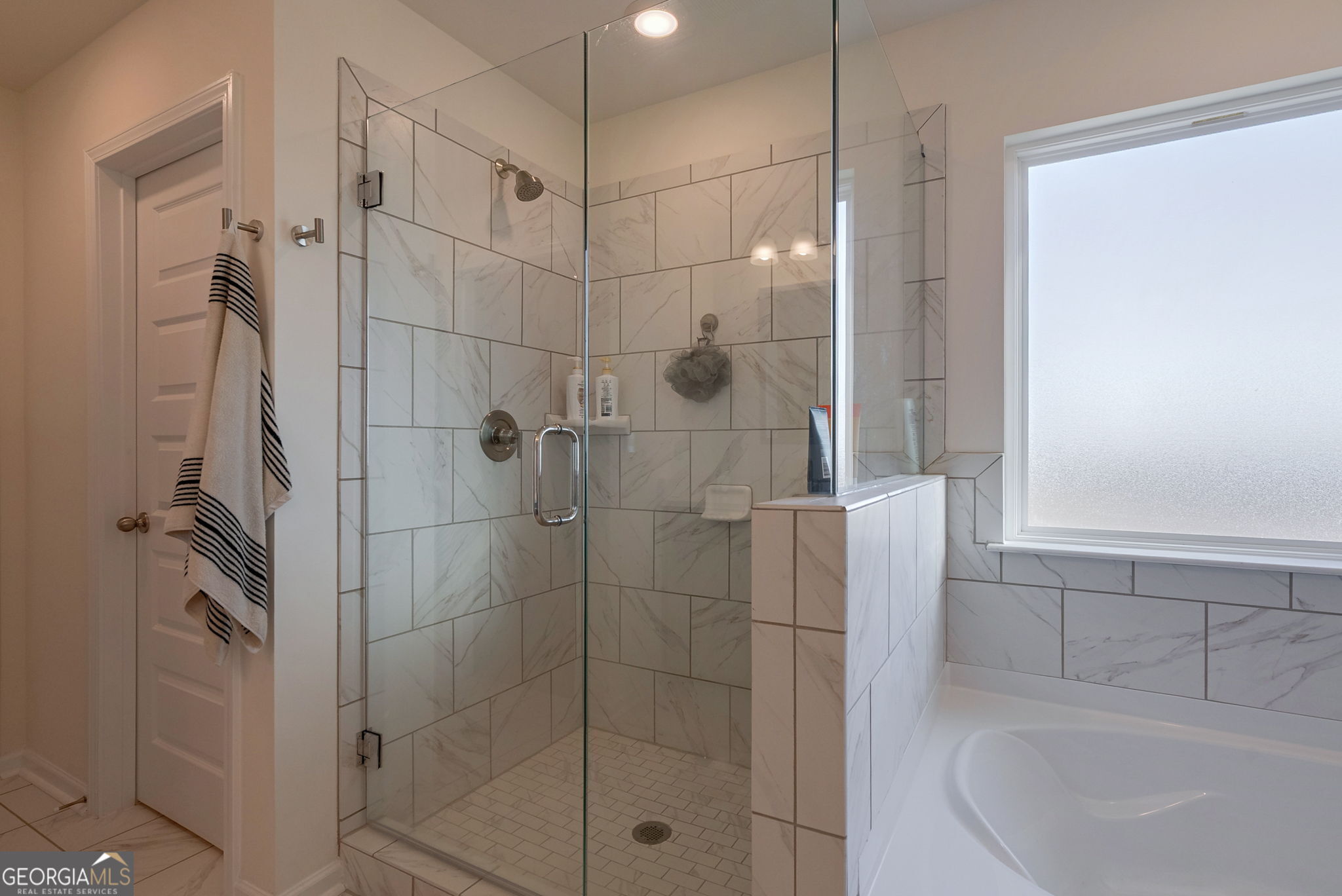 1110 Brookstone Crossing Statham, GA 30666 - Photo 44 of 69 a bathroom with a shower and a sink