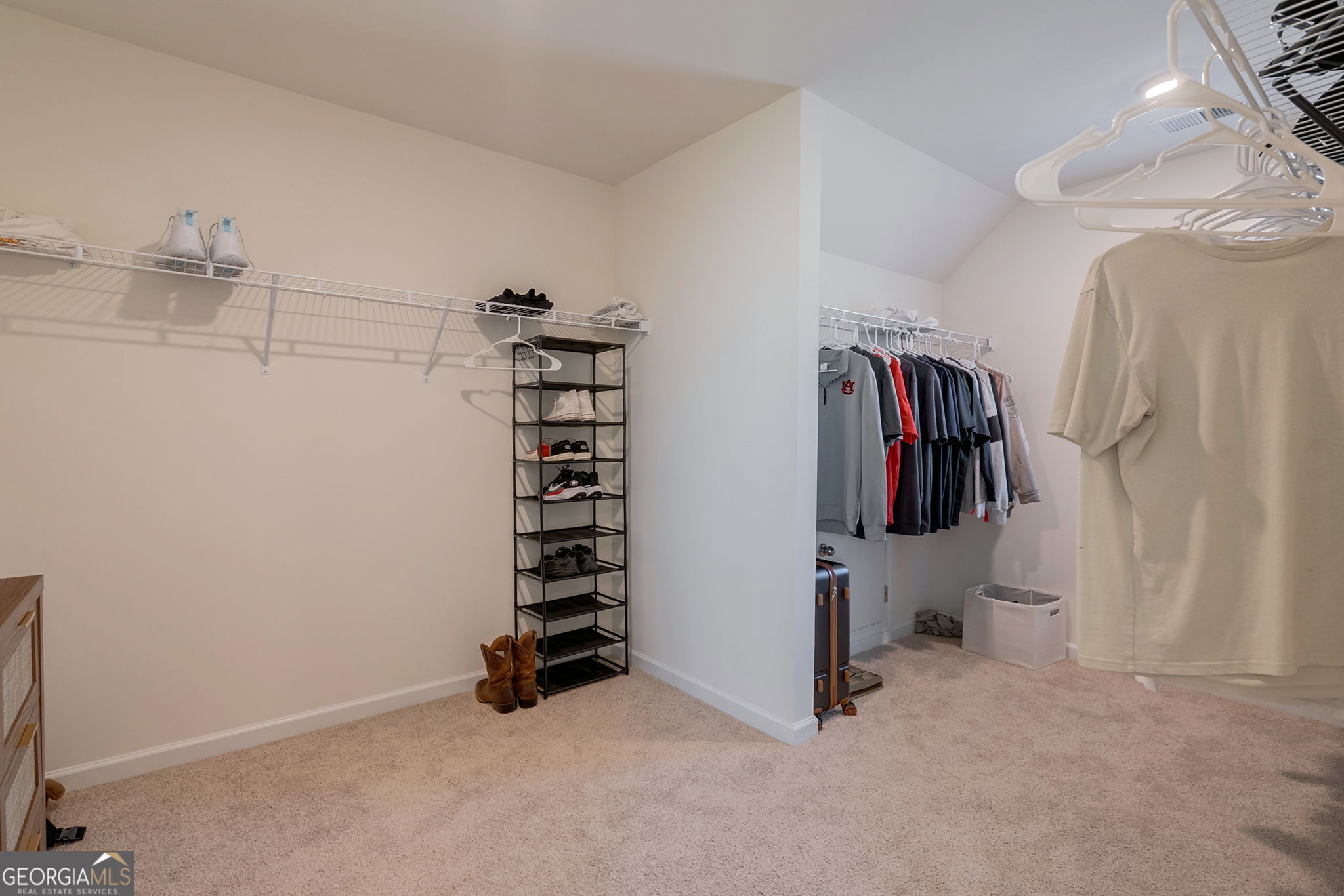 1110 Brookstone Crossing Statham, GA 30666 - Photo 45 of 69 a view of walk in closet with clothes and shoes