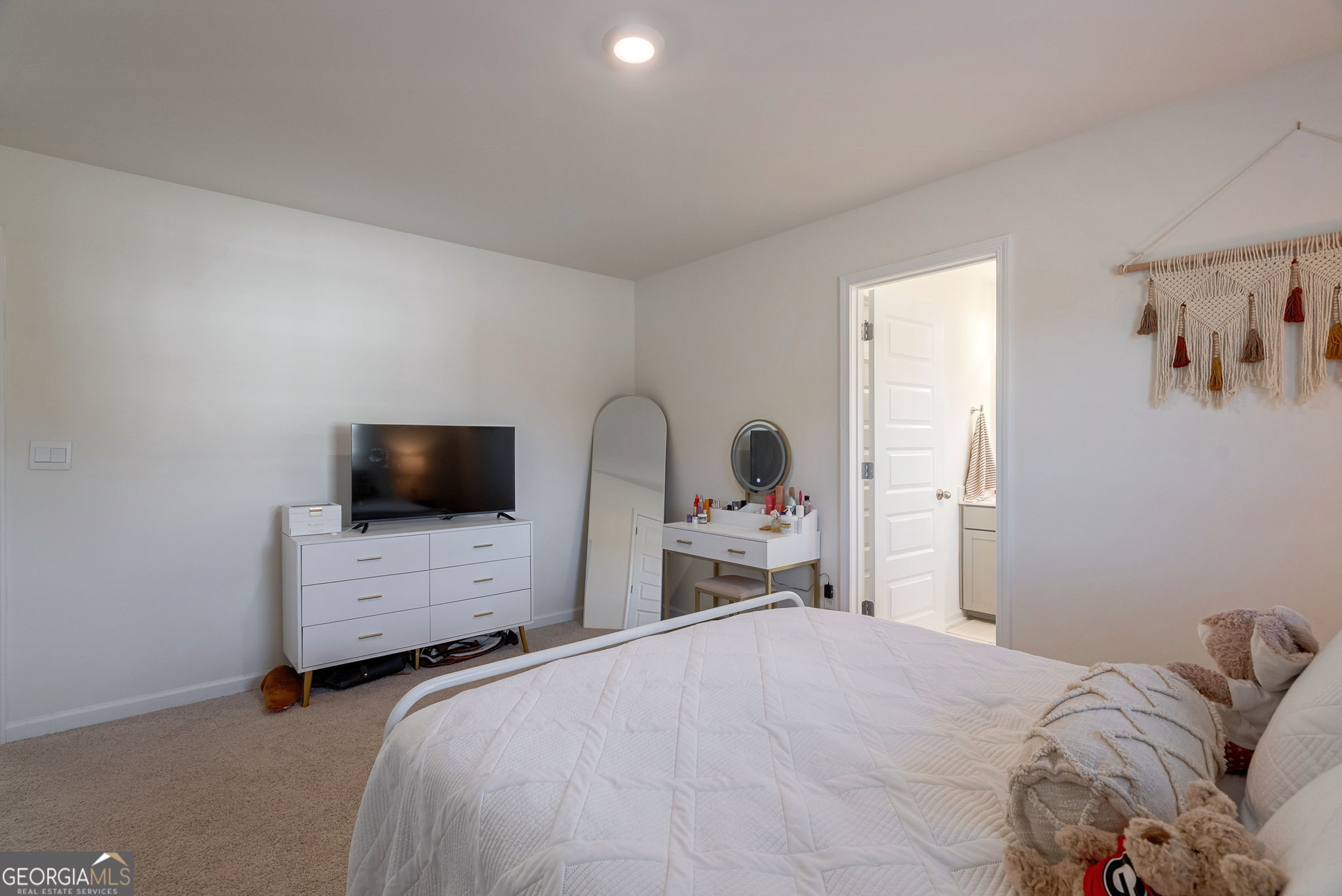 1110 Brookstone Crossing Statham, GA 30666 - Photo 49 of 69 a bedroom with a bed and a flat screen tv