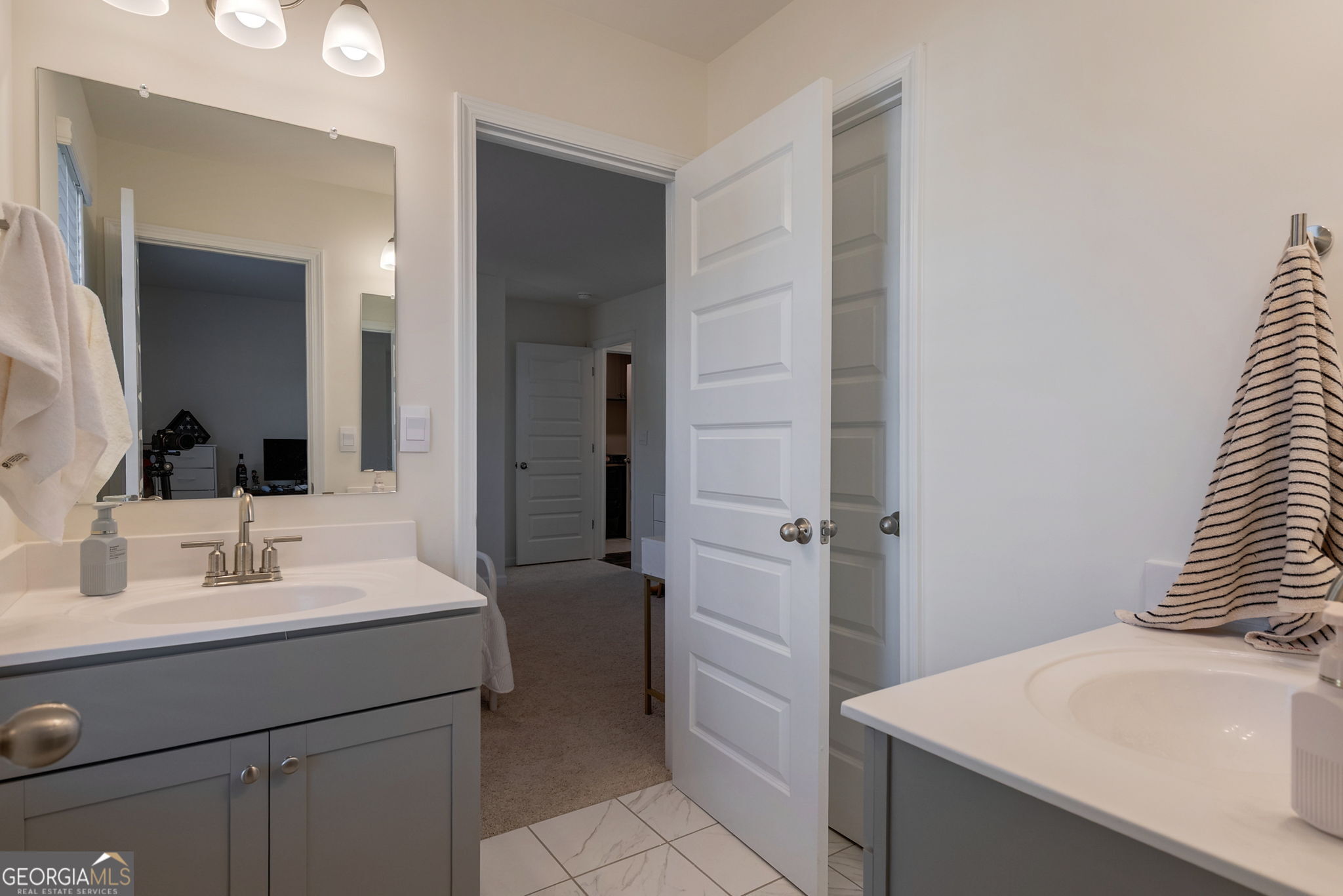 1110 Brookstone Crossing Statham, GA 30666 - Photo 53 of 69 a bathroom with a sink and a mirror