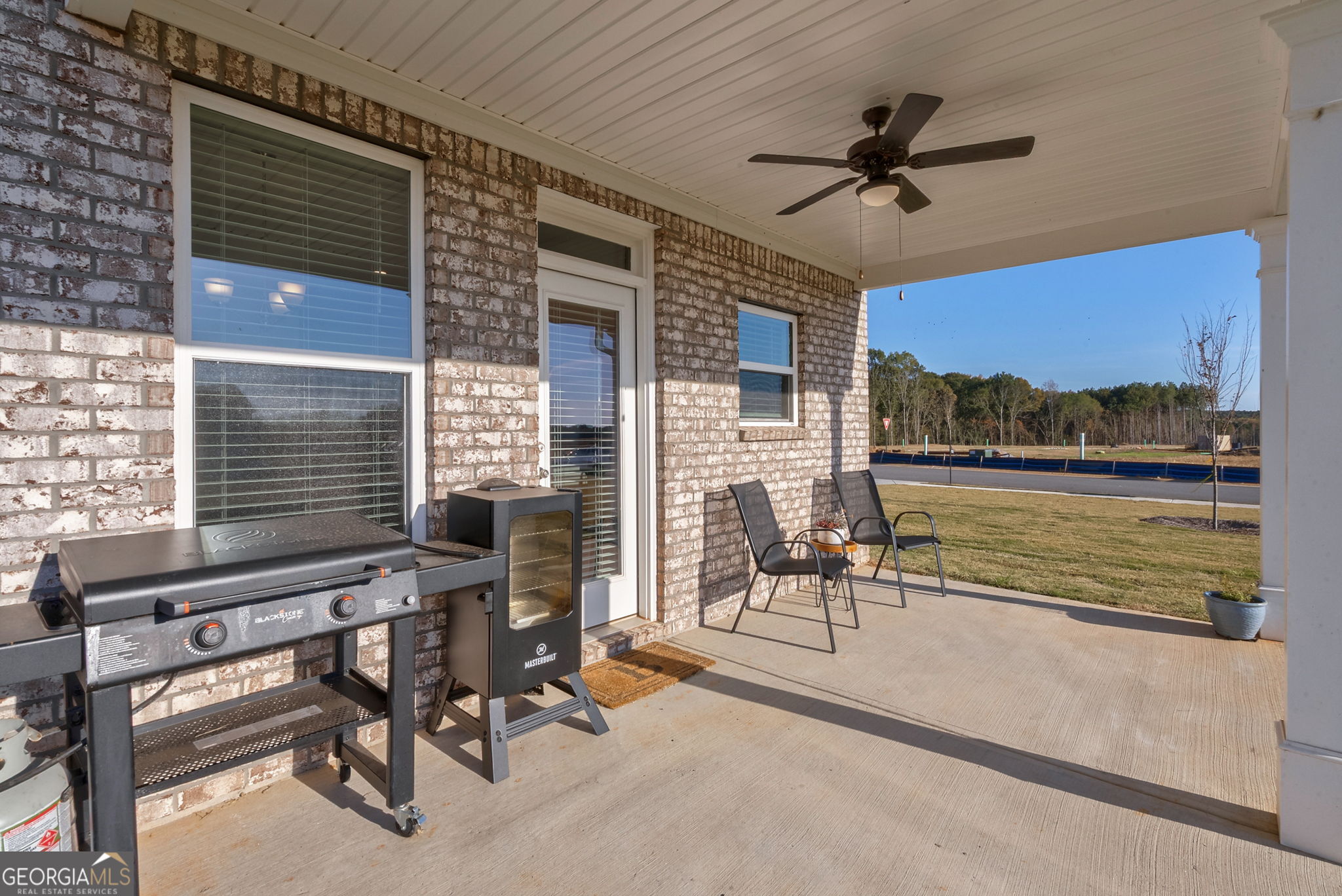 1110 Brookstone Crossing Statham, GA 30666 - Photo 59 of 69 a view of a livingroom with couch and a ceiling fan