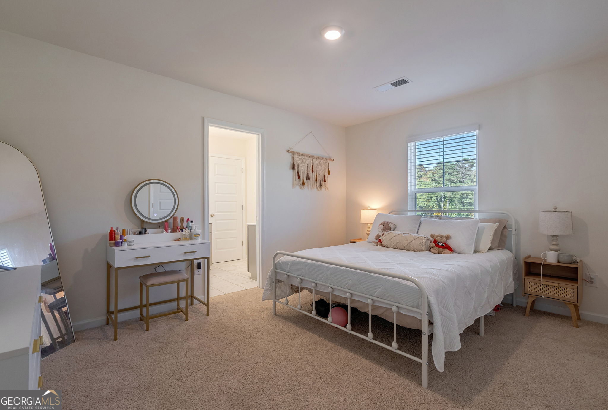 1110 Brookstone Crossing Statham, GA 30666 - Photo 6 of 69 a bedroom with a bed a table and a window