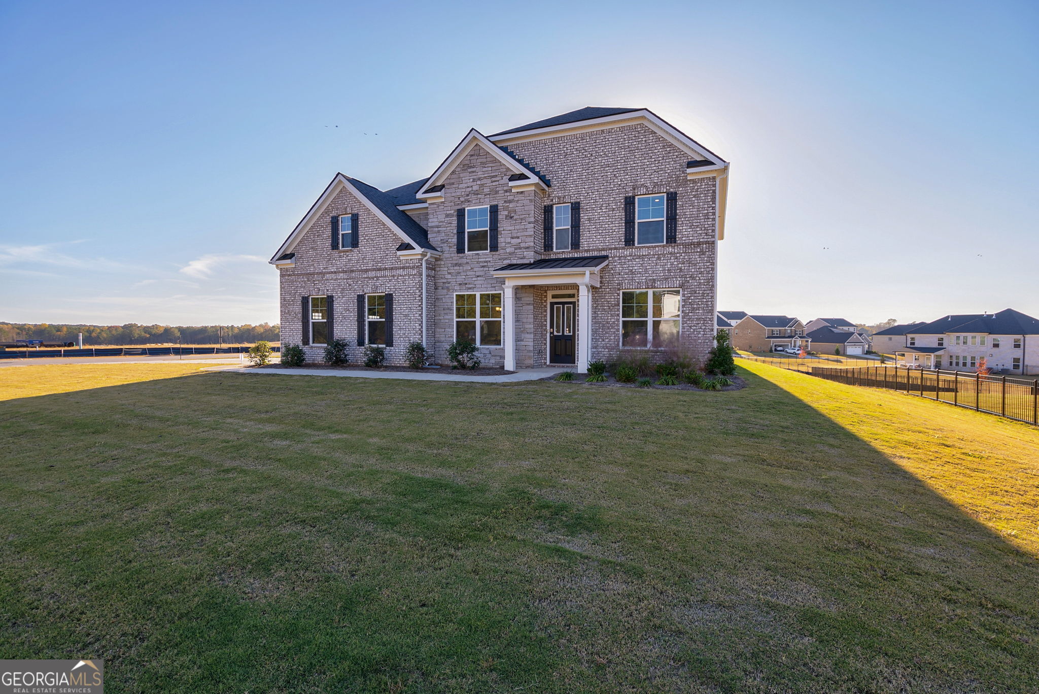 1110 Brookstone Crossing Statham, GA 30666 - Photo 9 of 69 a front view of a house with swimming pool having outdoor seating