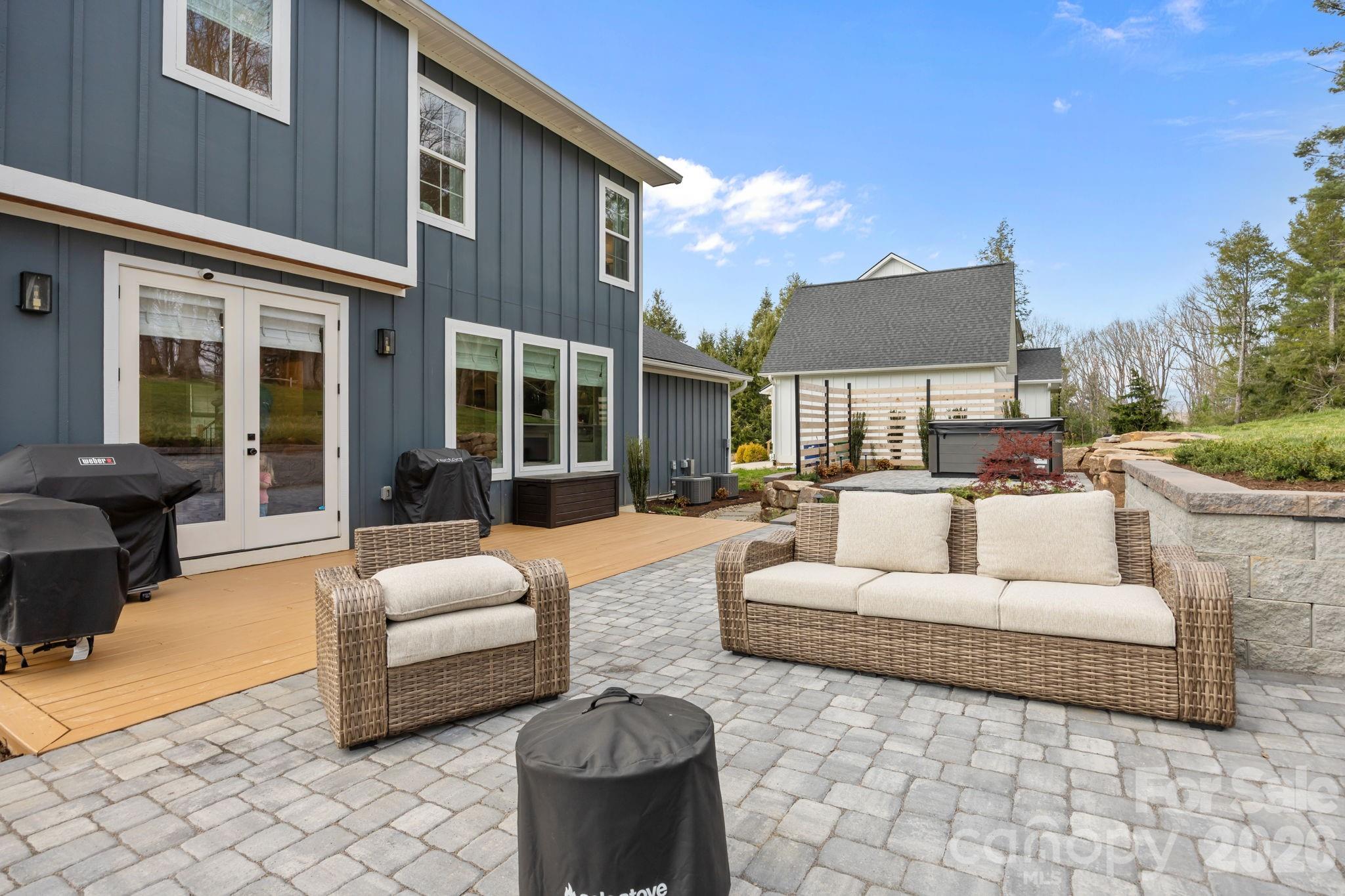 234 Gravely Branch Road Fletcher, NC 28732 - Photo 32 of 46 a patio with couches a fire pit and outdoor seating