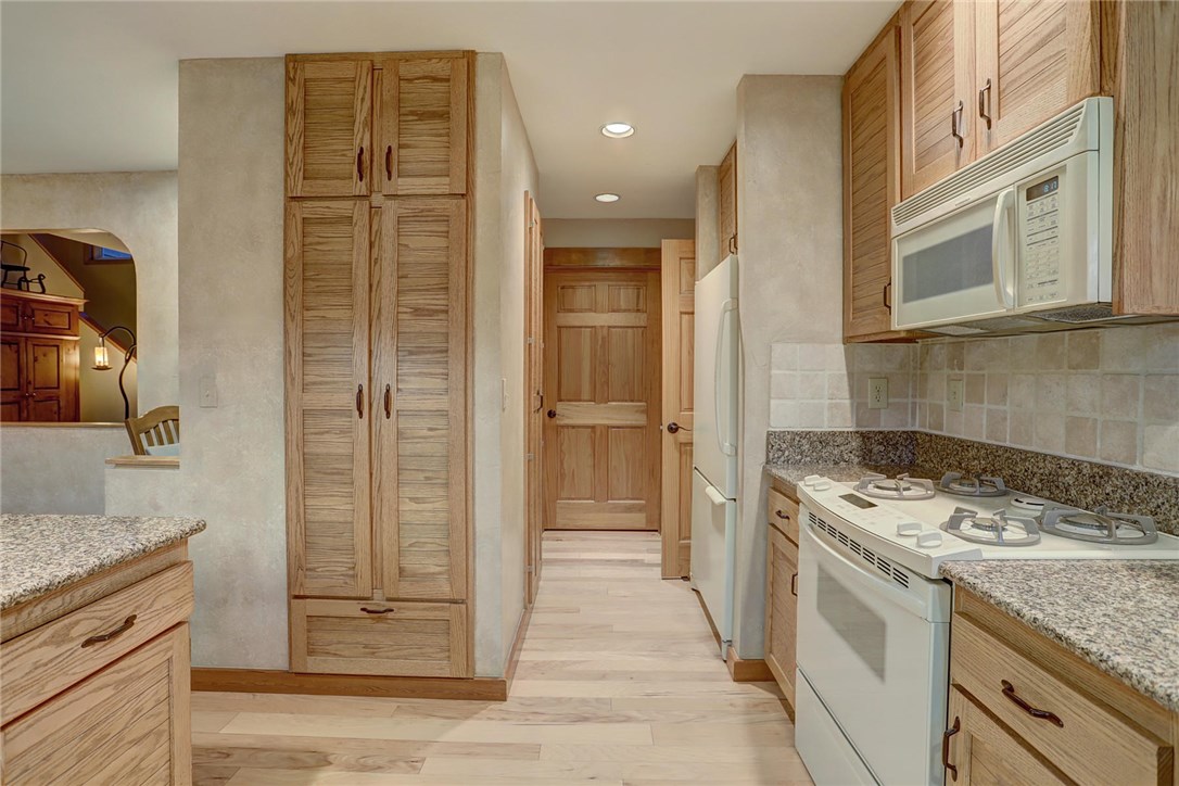 385 Riverside Drive Silverthorne, CO 80498 - Photo 10 of 35 Two large pantry cabinets. Note: Appliances in these photos will be upgraded.