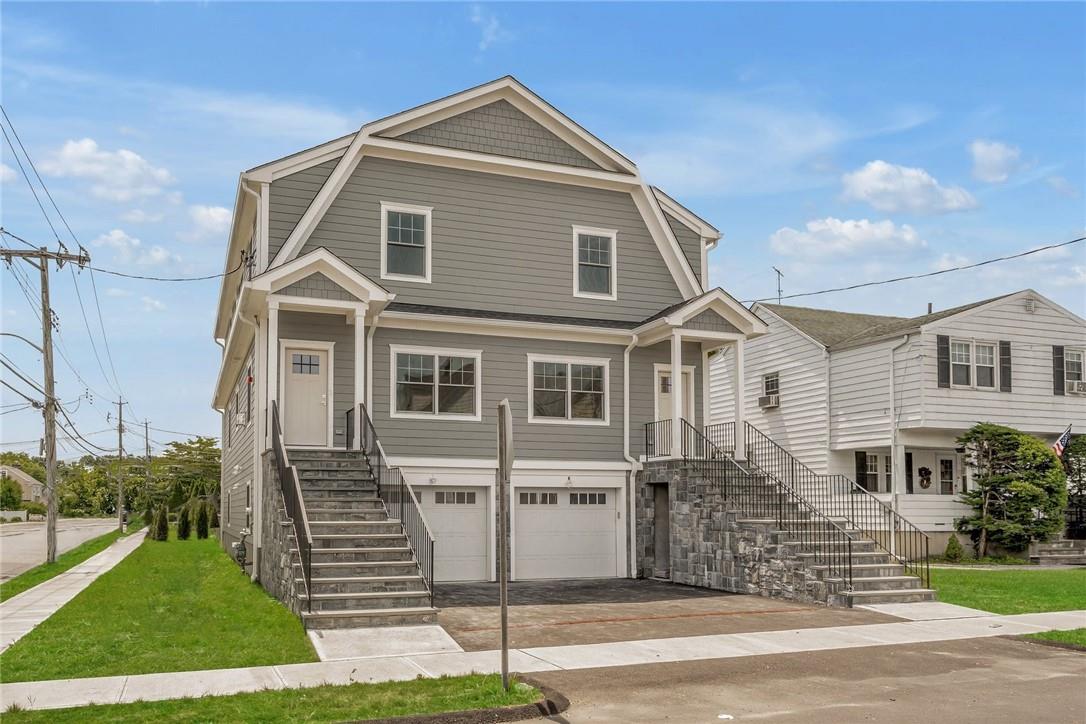 83-85 Webster Avenue Harrison, NY 10528 - Photo 1 of 1 a front view of a house with a yard
