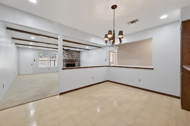 a view of a room with a ceiling fan