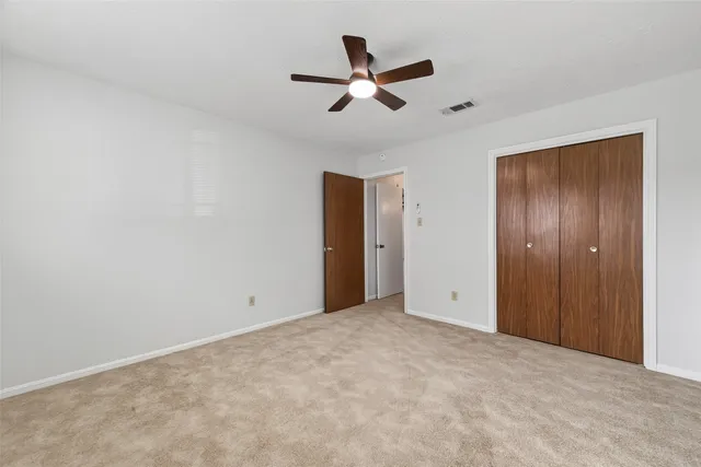 a view of room with ceiling fan