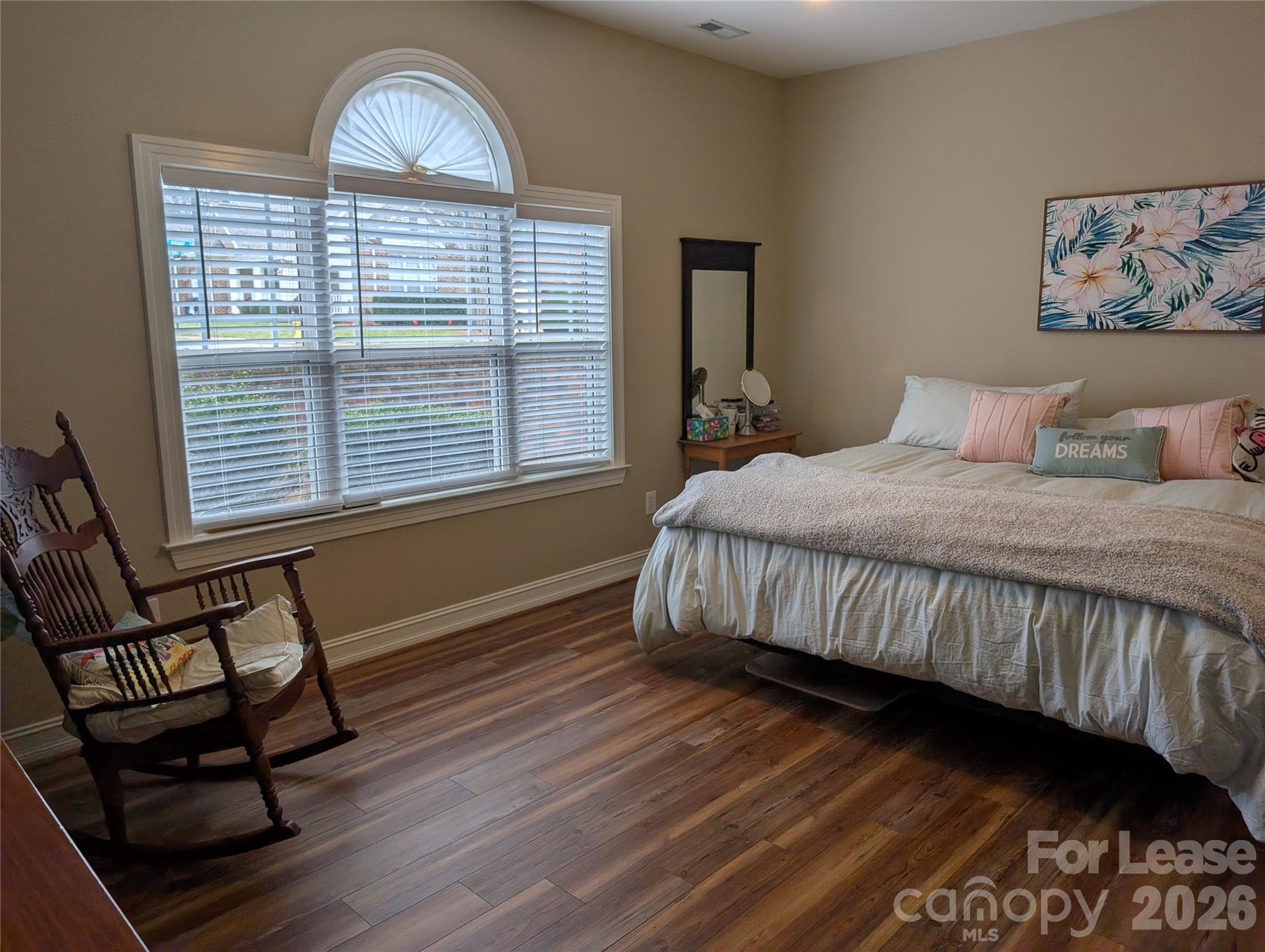 20207 Colony Point Lane Cornelius, NC 28031 - Photo 14 of 26 a bedroom with a bed and a window