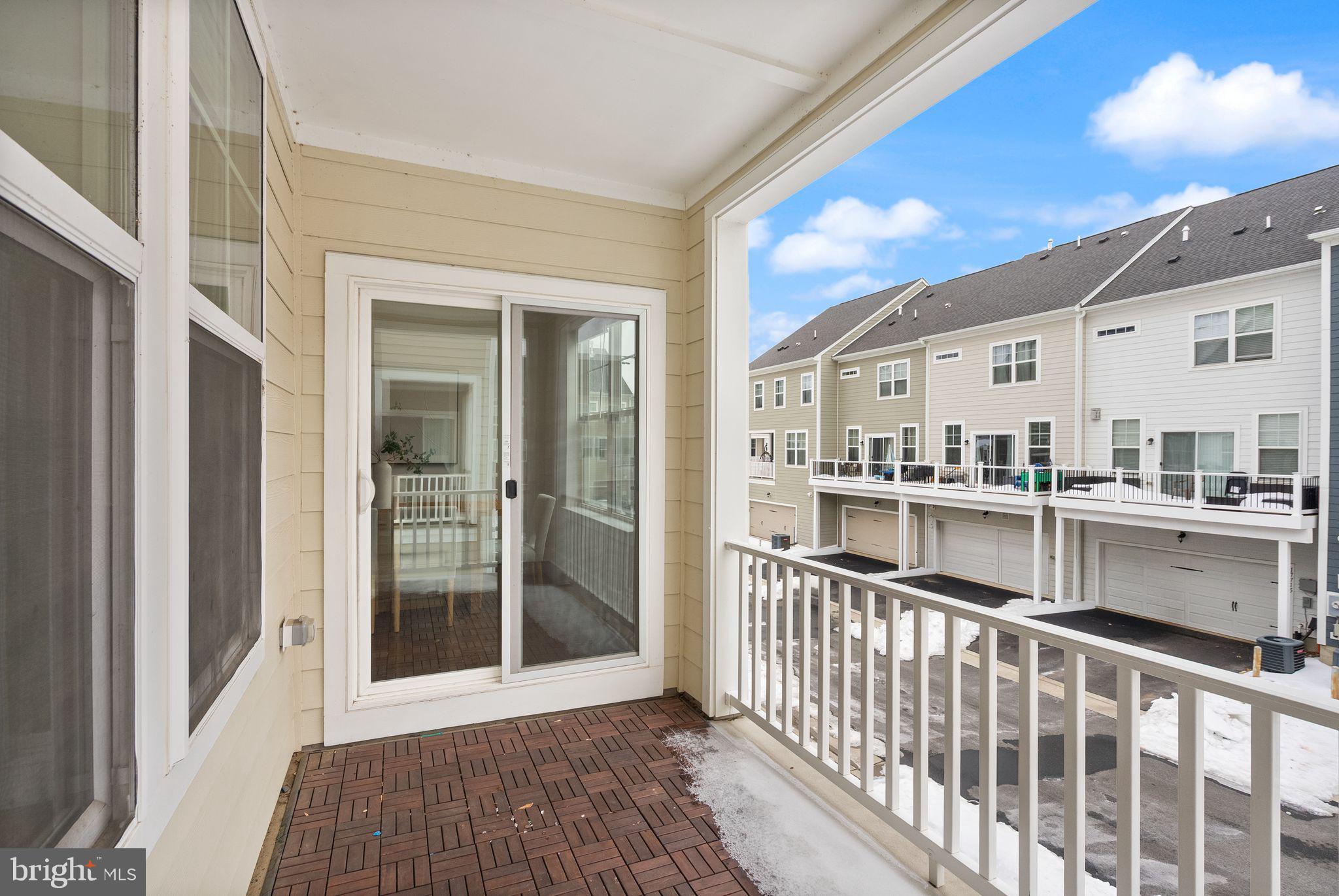 17762 Kingfisher Isle Road Dumfries, VA 22026 - Photo 16 of 62 a view of a balcony with wooden floor and fence