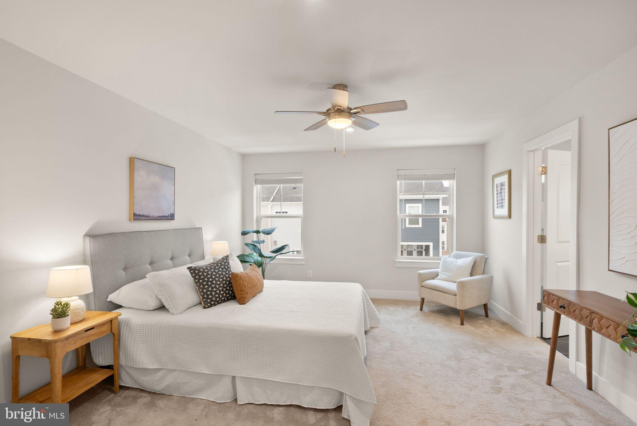 17762 Kingfisher Isle Road Dumfries, VA 22026 - Photo 24 of 62 a bedroom with a bed and a chandelier