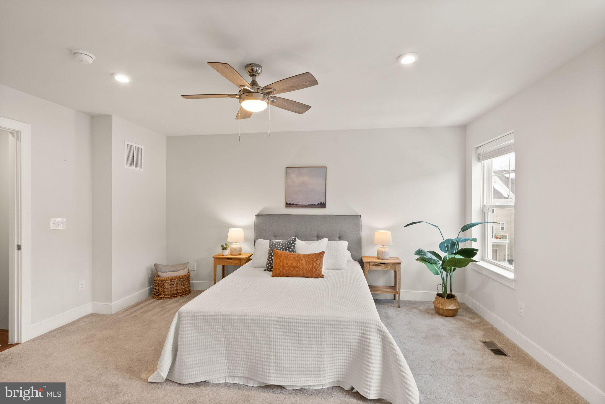 17762 Kingfisher Isle Road Dumfries, VA 22026 - Photo 25 of 62 a bedroom with a bed and a chandelier