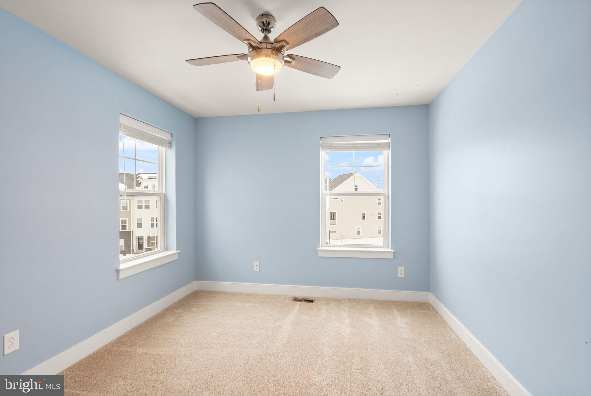 17762 Kingfisher Isle Road Dumfries, VA 22026 - Photo 33 of 62 a view of an empty room with a window and a ceiling fan