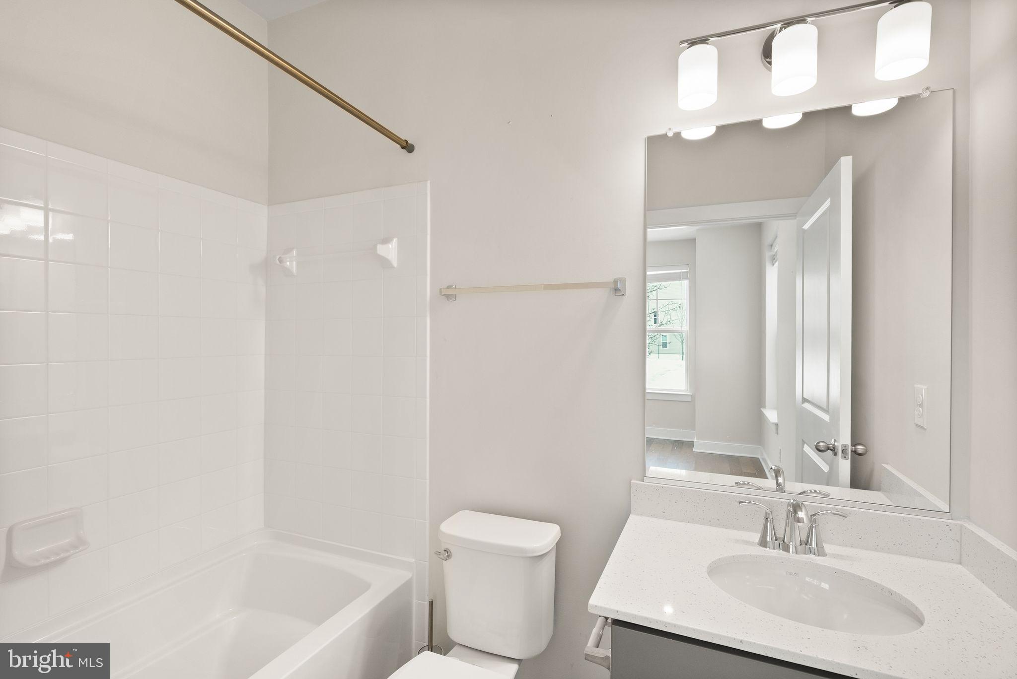 17762 Kingfisher Isle Road Dumfries, VA 22026 - Photo 43 of 62 a bathroom with a sink a toilet and shower