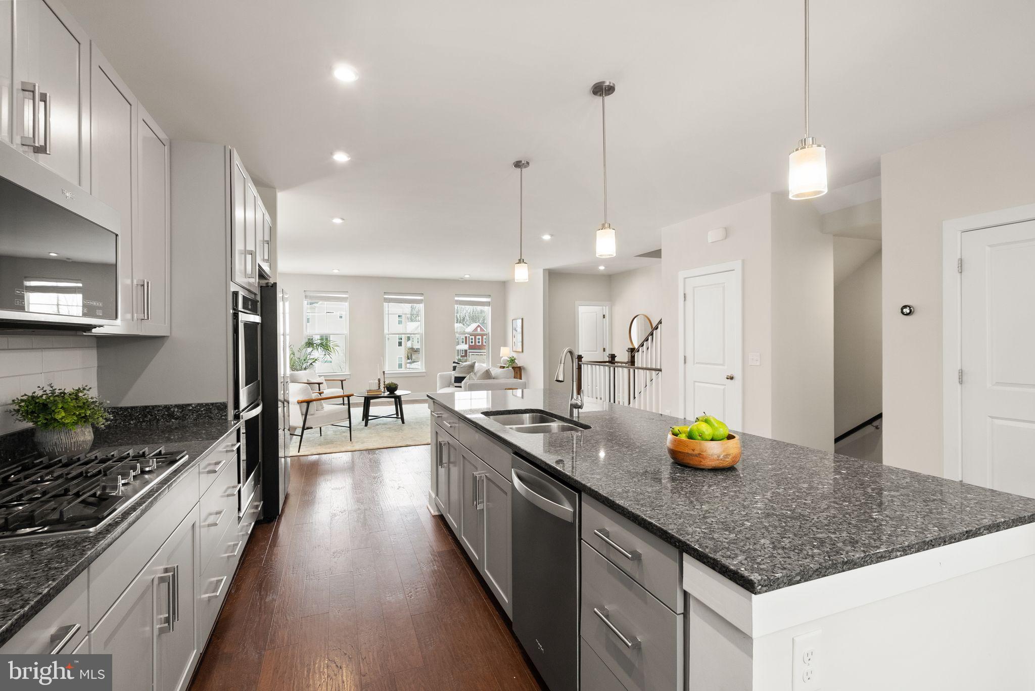17762 Kingfisher Isle Road Dumfries, VA 22026 - Photo 9 of 62 a kitchen with a sink a counter space appliances and cabinets