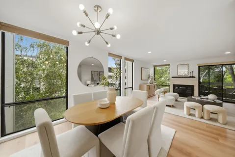 a view of a dining room with furniture window and outside view