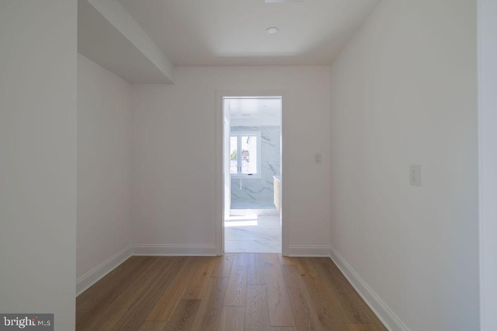 1202 Potomac Street Northwest Washington, DC 20007 - Photo 18 of 37 a view of an empty room with wooden floor